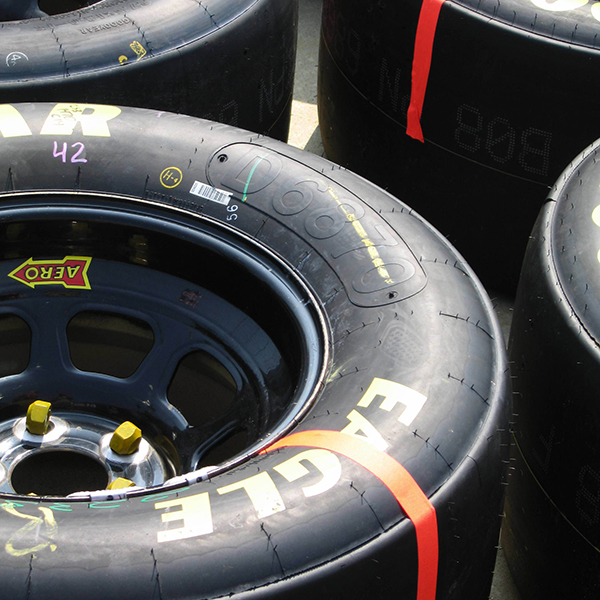 a group of tires with a red tape
